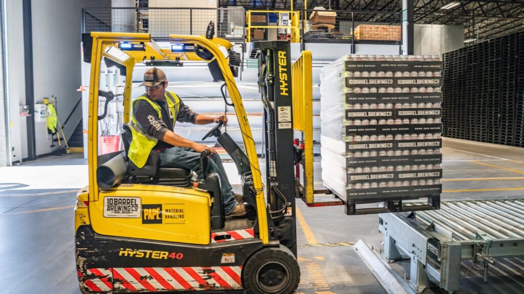 warehouse worker operating a forklift